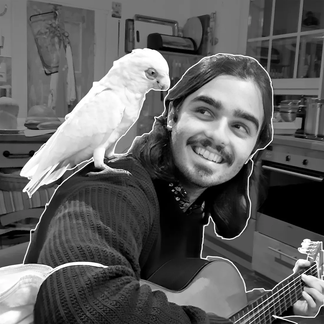 Lucas Cavanna with a white cockatoo on his shoulder
